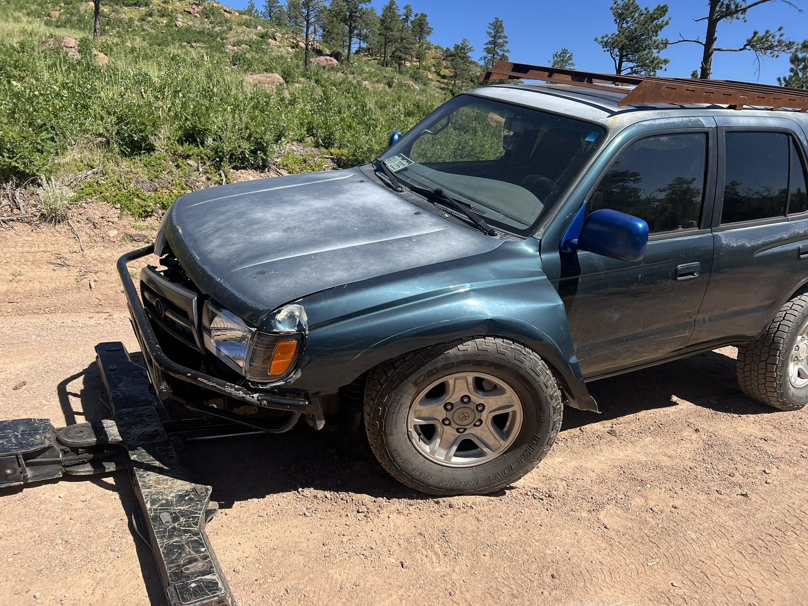 Toyota 4Runner on a recovery trailer in the Colorado mountains